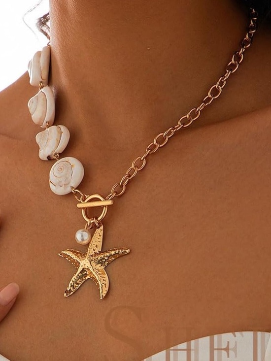 Anthropologie Jewelry - Anthropologie Gold Starfish and White Shell Toggle Necklace